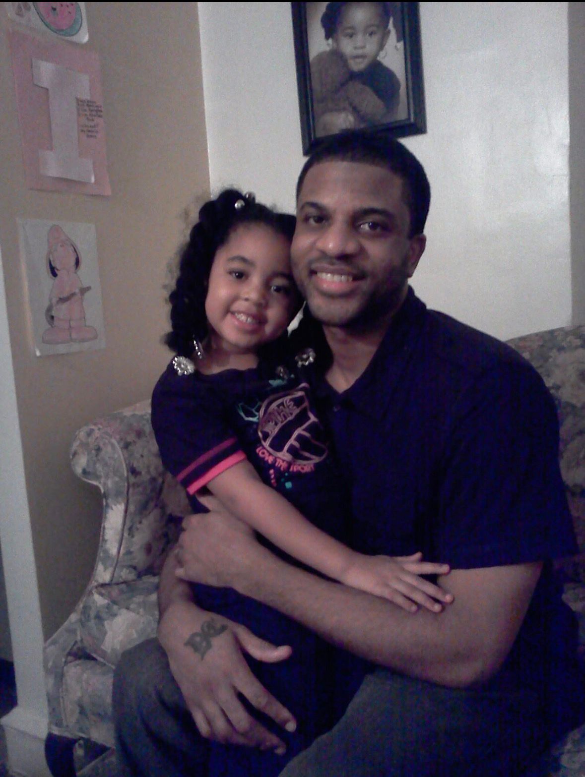 Tommy Kaine smiling with his daughter Gracie